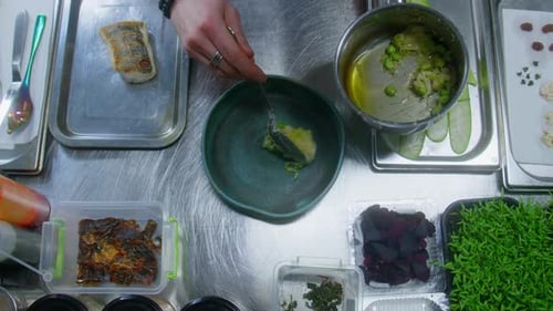 Chef Plating an Elegant Dish in Kitchen
