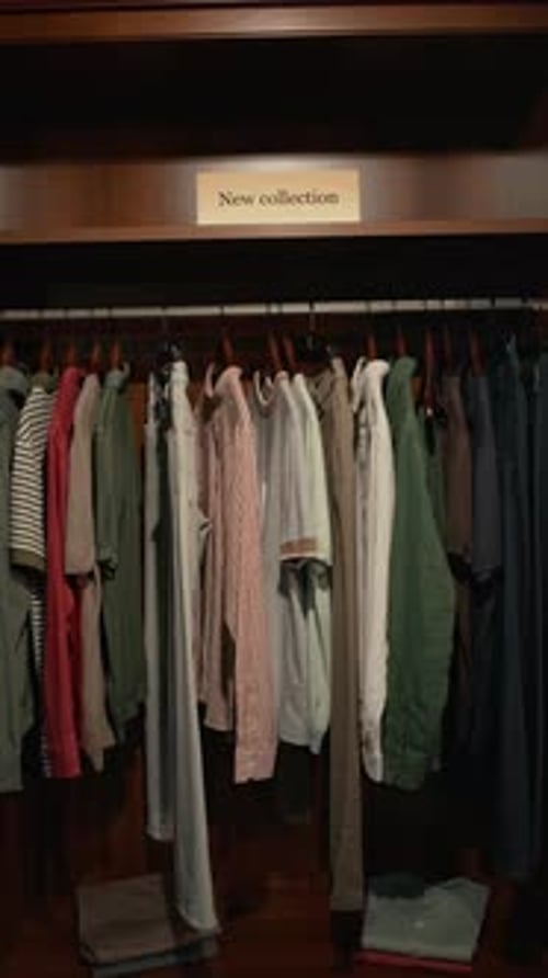 Section of Wardrobe with New Collection of Menswear in Clothing Store
