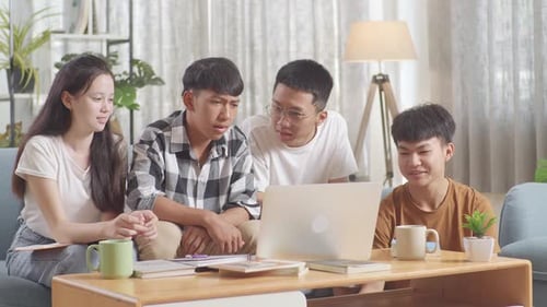 Young Adults Enjoying Video Call Together Indoors