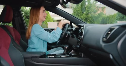 Young Woman Adjusts Sun Visor in Modern Car