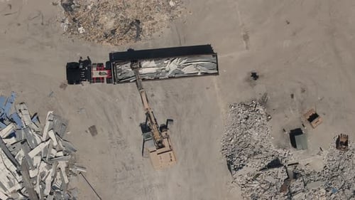 Demolition of the Building Excavator Working Rubbish in a Demolition Site Top Down Aerial View of