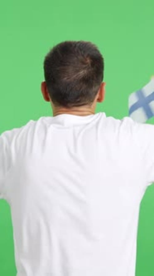 Rear View of a Man Waving a Finnish Pennant