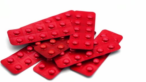 Pile of Red Pills in Blister Packs