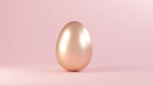Modern Golden Egg Rotating on Soft Pink Background for Easter