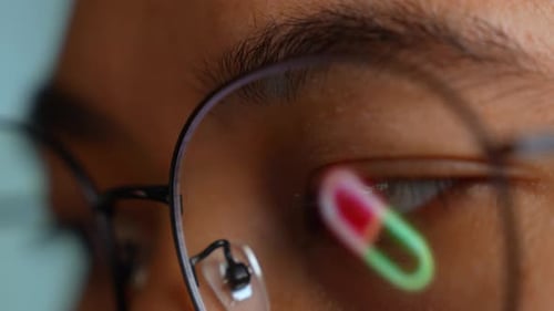 Close Up of Eye with Pill Reflection
