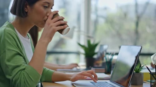 Young Adults Working Together in Modern Office Space