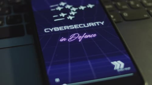 Cybersecurity in Defense Inscription on Smartphone Screen with Dark Blue Background with Linear