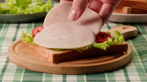 Making Open Faced Sandwich with Lettuce Tomato Cheese