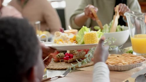 Family Sharing Meal Together at Dining Table