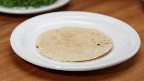 Preparing Delicious Flatbread Meal with Beans at Home