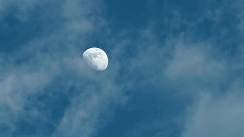 Waxing Gibbous Moon Shines in a Cloudy Sky
