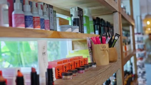 Close Up A Woman in an Eco Market Chooses Aromatic Oils Natural Cosmetics