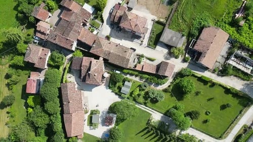 DRONE FLYING OVER A SMALL HOUSING COMPLEX IN THE COUNTRYSIDE