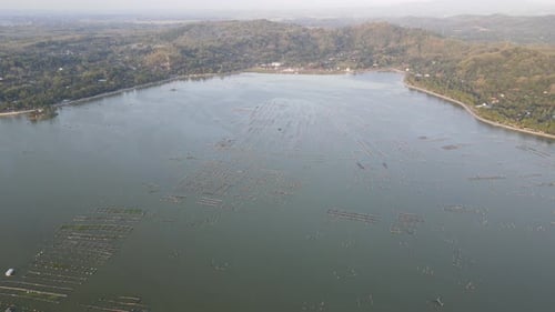 Aerial sunset view of cultivate fish on the lake such as cat fish is alternative to divers the food