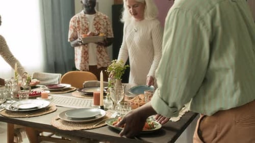 Adults Preparing Food on Dining Table