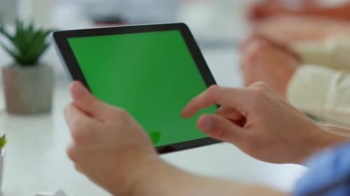 Unknown Business Man Finger Touching Mockup Tablet Screen in Office. Male Hands