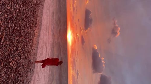 A Happy Girl at Sunset By the Sea