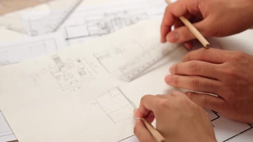 Professional engineer team discussion about house design. Closeup. Delineation.