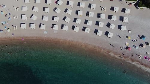 Aerial view of the seaside umbrellas and people