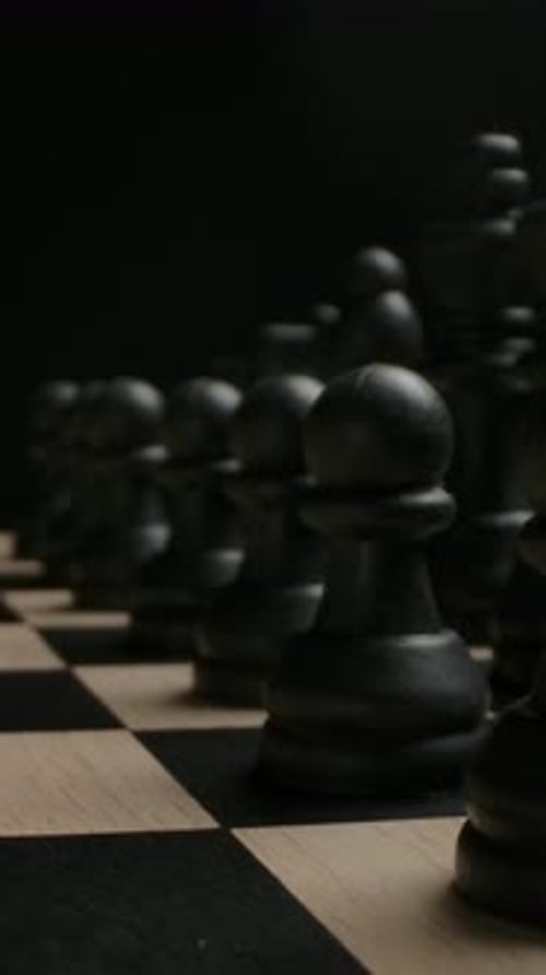 Black Chess Pieces on Board Close Up