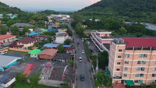 Drone Following the Road From the Air in a Rural Area of Thailand Between the Mountains