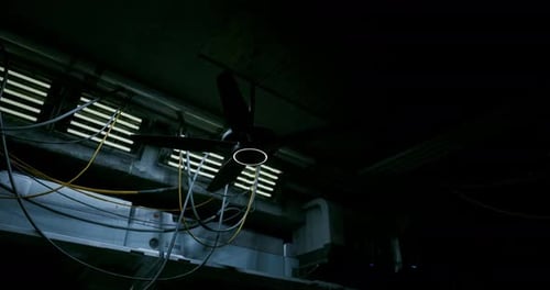 Dark Industrial Sci-Fi Room with Rotating Fan