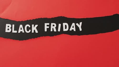Black Friday sale written on red paper