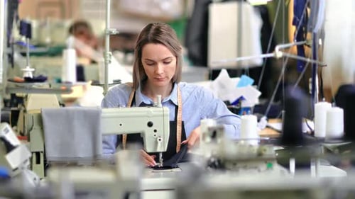 Concentrated Woman Dressmaker Working at Production Line Professional Dressmaking Tailoring Atelier
