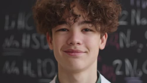 Teen Student Smiles in Science Classroom