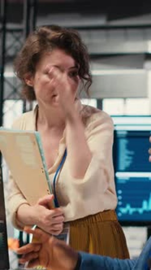 Vertical Video Multiethnic Work Team Consulting Each Other in Completing Monthly Reports