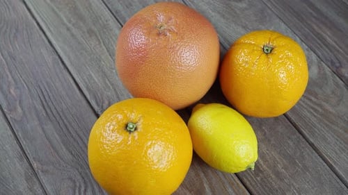 Colorful Citrus Fruit on Wooden Table