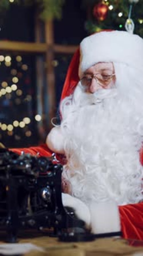 Santa Claus Typing Christmas Letter on Typewriter