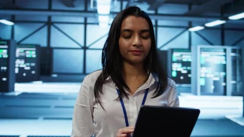Young Woman Using Tablet in Data Center