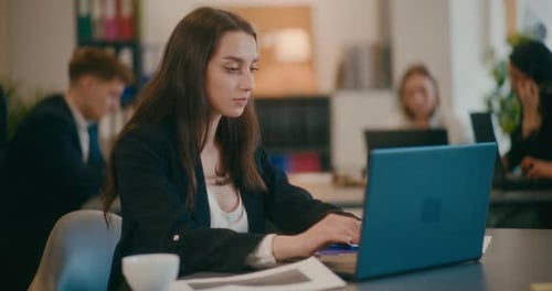 Businesswoman Working on Laptop in Office