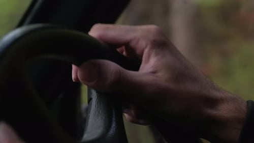 Close Up of Person Driving a Car