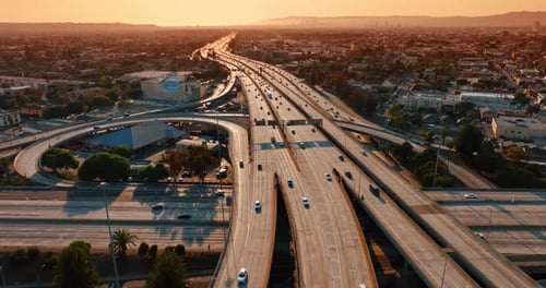 Flight above the busy highways in the famous interchange of Los Angeles, California, US
