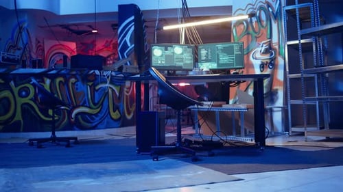 Modern Graffiti Room with Computers at Night