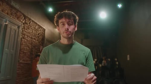 Portrait of Young Actor with Play Script on Theater Stage