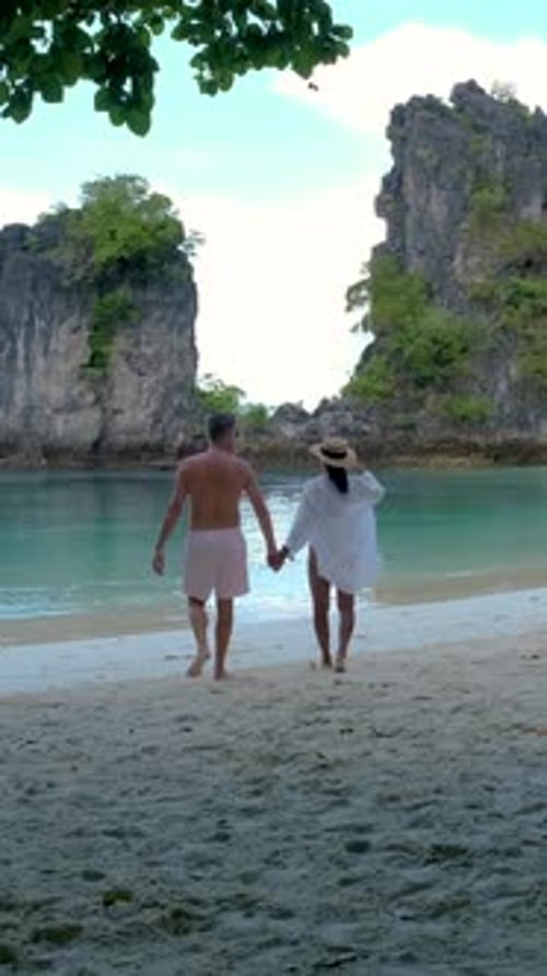 Couple Men and Women on a Tropical White Beach in Thailand Koh Hong Island Krabi