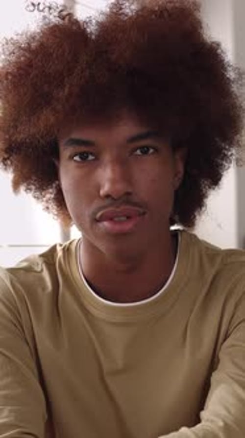 POV or Front Portrait of Happy Millennial Latin American Guy Smiling at Camera