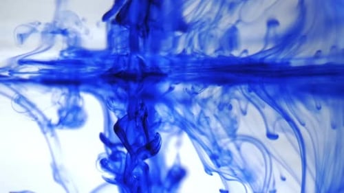 Blue Ink Swirling in Clear Water