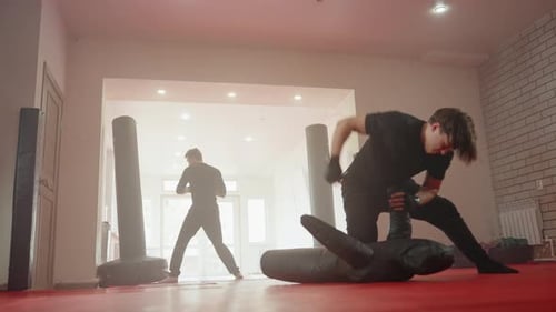 Athlete Training in Martial Arts Gym One Man Practicing Ground Combat Drills