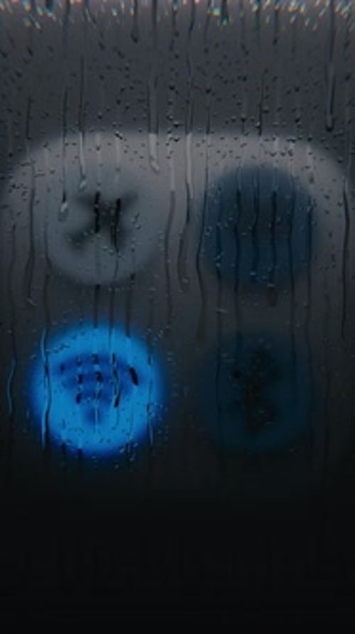 Abstract Rain Streaks on Glass with Blurred Evolving Lights