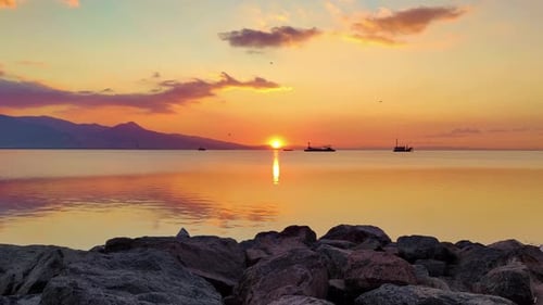 Coastal Cliffs At Sunset And Various Ships Working At Sea