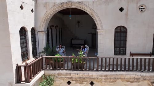 Balcony Relaxation at Ornate Urban Building