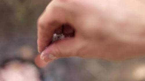 Hand Sprinkles Salt in Slow Motion