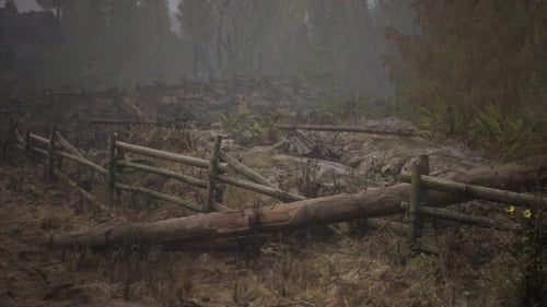 An Old Wood Fence with a Country Field Behind It