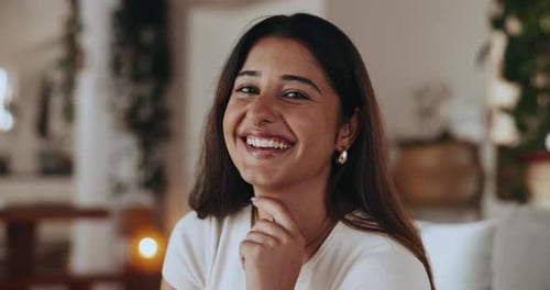 Smiling Woman Posing Indoors Looking At Camera