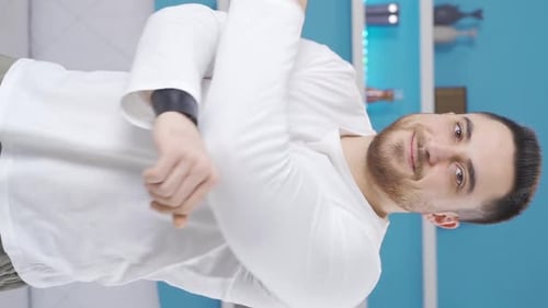 Young Adult Male Stretching Arms for Warm Up