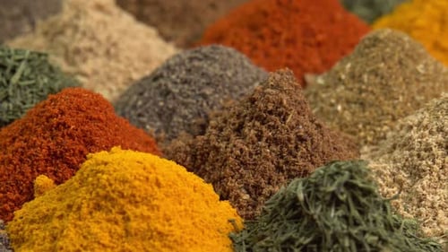 Spice and seasoning. Various fragrant spice market. Heap different Asian Spices rotated on wooden
